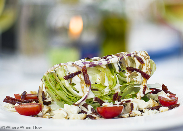 A photograph of the Grilled Iceberg Wedge with Gorgonzola Cheese at Coco Bistro, Grace Bay Road, Providenciales (Provo), Turks and Caicos Islands.