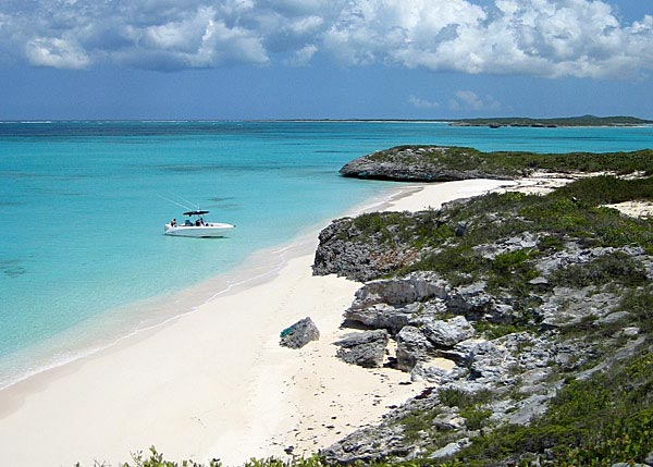 A photograph of a remote and pristine beach on Joe Grant Cay, Turks and Caicos Islands.