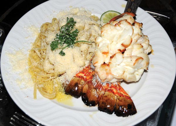A photograph of Baked Caicos Lobster Tail at Baci Ristorante, Turtle Cove, Providenciales (Provo), Turks and Caicos Islands.