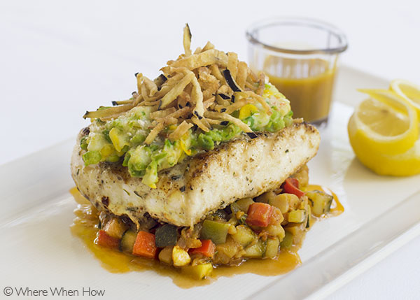 A photograph of Grilled TCI Grouper with shrimp topping and pumpkin sauce.Grace’s Cottage, Grace Bay, Providenciales (Provo), Turks and Caicos Islands.